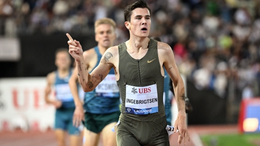 Jakob Ingebrigtsen of Norway celebrates after winning the 1500m Men at the Athletissima IAAF Diamond League international athletics meeting in the Stade Olympique de la Pontaise in Lausanne, Switzerland, Friday, Aug. 26, 2022. (Laurent Gillieron/Keystone via AP)