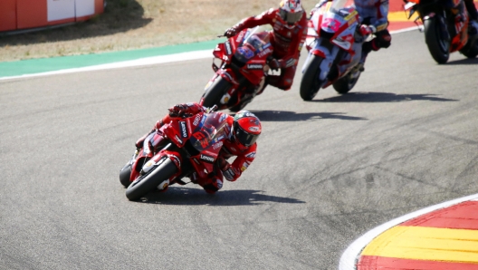 epa10191398 Italian MotoGP rider Francesco 'Pecco' Bagnaia (front) of the Ducati Lenovo team leads the pack during the Motorcycling Grand Prix of Aragon at Motorland Circuit in Alcaniz, northeastern Spain, 18 September 2022.  EPA/Javier Cebollada