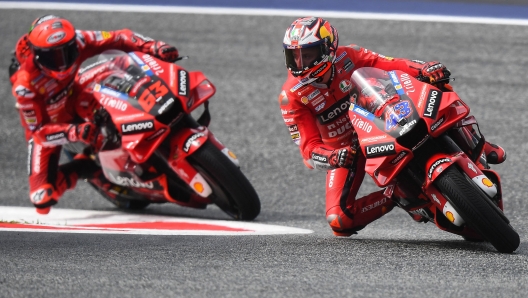 Ducati Lenovo's Australian rider Jack Miller (R) competes next to Ducati Lenovo's Italian rider Francesco Bagnaia during the first free practice session of the MotoGP Austrian Grand Prix at the Redbull Ring racetrack in Spielberg on August 19, 2022. (Photo by VLADIMIR SIMICEK / AFP)