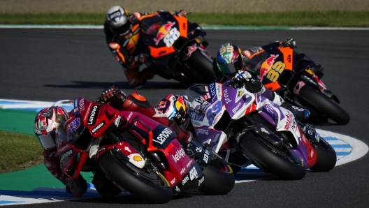 Australian rider Jack Miller of the Ducati Lenovo Team steers his motorcycle followed by Spanish rider Jorge Martin of Prima Pramac Racing during the MotoGP race of the Japanese Motorcycle Grand Prix at the Twin Ring Motegi circuit in Motegi, north of Tokyo Sunday, Sept. 25, 2022. (AP Photo/Shuji Kajiyama)