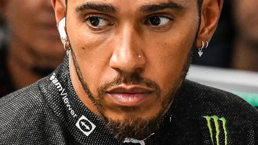 Mercedes' British driver Lewis Hamilton looks on before a practice session for the Formula One Singapore Grand Prix night race at the Marina Bay Street Circuit in Singapore on October 1, 2022. (Photo by MOHD RASFAN / AFP)