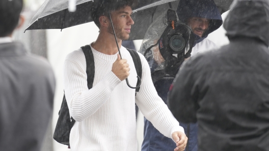 AlphaTauri driver Pierre Gasly of France walks at the paddock prior to the Japanese Formula One Grand Prix at the Suzuka Circuit in Suzuka, central Japan, Friday, Oct. 7, 2022. (AP Photo/Toru Hanai)