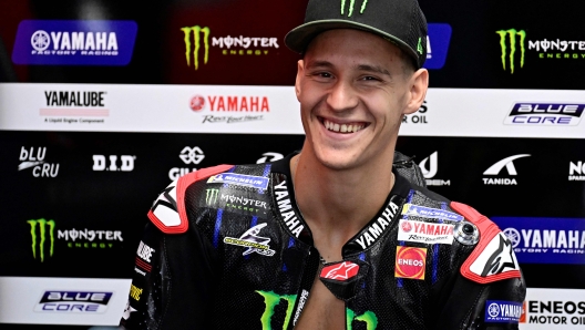 Yamaha French rider Fabio Quartararo smiles in the box during the second free practice session of the MotoGP Valencia Grand Prix at the Ricardo Tormo racetrack in Cheste, on November 4, 2022. (Photo by JAVIER SORIANO / AFP)