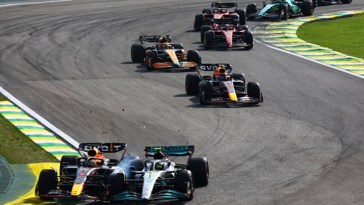 SAO PAULO, BRAZIL - NOVEMBER 13: Max Verstappen of the Netherlands driving the (1) Oracle Red Bull Racing RB18 and Lewis Hamilton of Great Britain driving the (44) Mercedes AMG Petronas F1 Team W13 collide during the F1 Grand Prix of Brazil at Autodromo Jose Carlos Pace on November 13, 2022 in Sao Paulo, Brazil. (Photo by Mark Thompson/Getty Images)