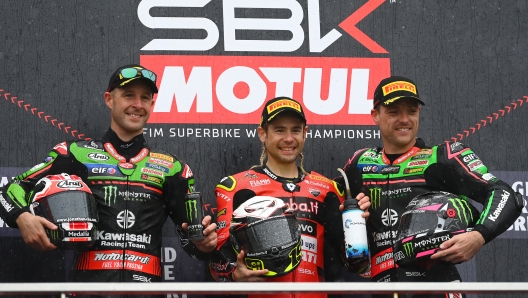 PHILLIP ISLAND, AUSTRALIA - NOVEMBER 20:  Jonathan Rea of Great Britain rides the #65 Kawasaki Racing Team WorldSBK Kawasaki, Alvaro Bautista of Spain riding the #19 Aruba.it Racing Ducati and Alex Lowes of Great Britain rides the #22 Kawasaki Racing Team WorldSBK Kawasaki stand on the podium after Race 2 during the 2022 MOTUL FIM Superbike World Championship at Phillip Island Grand Prix Circuit on November 20, 2022 in Phillip Island, Australia. (Photo by Quinn Rooney/Getty Images)