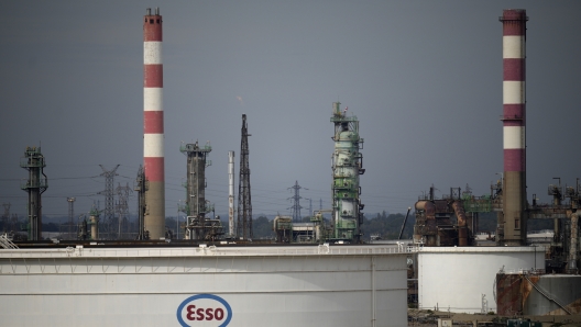 The Esso oil refinery is pictured Thursday, Oct. 13, 2022 in For-sur-Mer, southern France. French President Emmanuel Macron promised the situation in the country's gas stations will soon be back to "normal" as the government started requisitioning some workers at ExxonMobil's Esso gas stations amid an ongoing strike that is making life difficult for French drivers. (AP Photo/Daniel Cole)