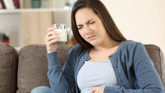 Woman suffering lactose intolerance