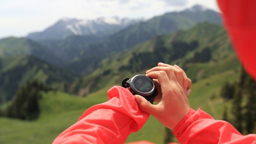 Woman hiker checking the altimeter