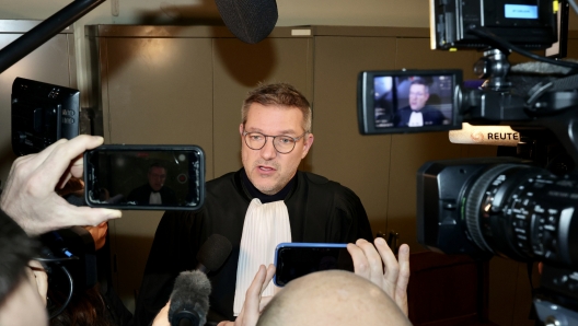 Laurent Kennes, lawyer for former member of the European Parliament Pier Antonio Panzeri, speaks with the media prior to a court hearing regarding detention at the Palais de Justice in Brussels, Tuesday, Jan. 17, 2023. (AP Photo/Olivier Matthys)