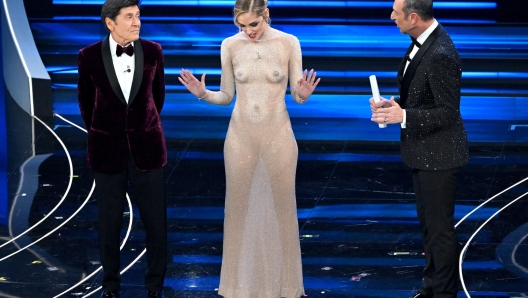 Italian fashion blogger, businesswoman and model Chiara Ferragni (C), Sanremo Festival host and artistic director Amadeus (R) and  Italian singer and Sanremo Festival co-host Gianni Morandi (L) on stage at the Ariston theatre during the 73rd Sanremo Italian Song Festival, in Sanremo, Italy, 07 February 2023. The music festival will run from 07 to 11 February 2023.  ANSA/ETTORE FERRARI