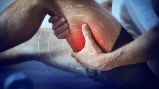 Detail of a representation of pain in the hamstrings with red color on a bluish image.