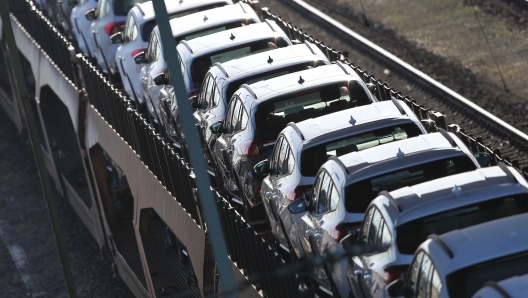 (FILES) In this file photo taken on February 23, 2022 cars are transported on a fright train at a depot in Mannheim, southwestern Germany. - German car sales fell sharply in June, official figures showed on July 7, 2022, as the sector remained gripped by supply issues. New car registrations in Europe's top economy fell by 18.1 percent year-on-year to 224,558 units in June, the federal transport authority KBA said in a statement. New car sales had already fallen by 10.2 percent in May and by 21.5 percent in April. (Photo by Daniel ROLAND / AFP)