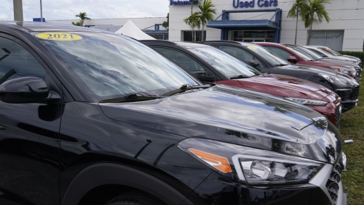 A line of cars are for sale at the Potamkin Hyundai dealership used car lot, Tuesday, Feb. 1, 2022, in Miami Lakes, Fla.  U.S. new vehicle sales were expected to tumble more than 20% in the second quarter compared with a year ago as the global semiconductor shortage continued to vex the industry. Yet demand continued to outstrip supply from April through June 2022, even with $5 per gallon gasoline, rampant inflation and rising interest rates. (AP Photo/Marta Lavandier)