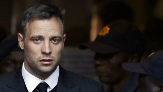 FILE - In this Wednesday, June 15, 2016, file photo, Oscar Pistorius leaves the High Court in Pretoria, South Africa, after his sentencing proceedings. South African former track star Oscar Pistorius has met with the father of Reeva Steenkamp, the woman he shot to death in 2013, as part of his parole process, the Steenkamp's family lawyer told The Associated Press on Friday July 1, 2022. (AP Photo/Themba Hadebe, File)