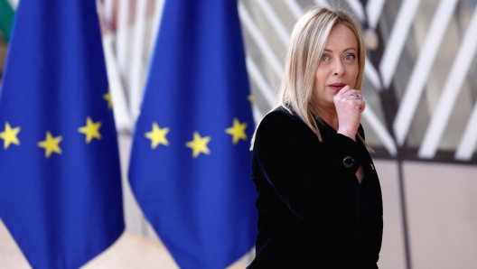 Italy's Prime Minister Giorgia Meloni arrives for a EU Summit, at the EU headquarters in Brussels, on March 23, 2023. - The two-day summit of the 27 European Union leaders in Brussels aims to build on previous European Council meetings where EU leaders will discuss the latest developments including continued EU support for Ukraine, the economy, energy, and migration. (Photo by Kenzo TRIBOUILLARD / AFP)