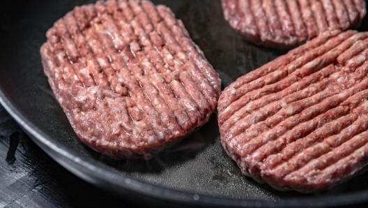 Frozen ground steak while cooking