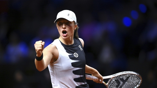 Poland's Iga Swiatek reacts against Belarus' Aryna Sabalenka during the WTA women's singles final match at Porsche Arena, Stuttgart, Germany, Sunday April 23, 2023. (Marijan Murat/dpa via AP)