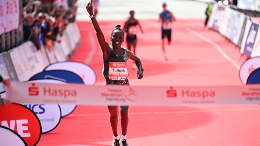 HAMBURG, GERMANY - APRIL 23: Dorcas Tuitoek of Kenya celebrates winning as she crosses the finish line at the Haspa Marathon Hamburg 2023 on April 23, 2023 in Hamburg, Germany. (Photo by Stuart Franklin/Getty Images for adidas)