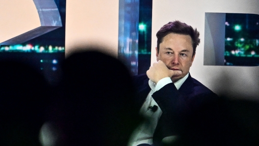 Twitter CEO Elon Musk arrives to speak at the Twitter 2.0: From Conversations to Partnerships, marketing conference in Miami, Florida, on April 18, 2023. (Photo by CHANDAN KHANNA / AFP)