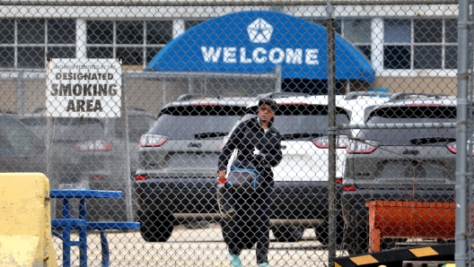 BELVIDERE, ILLINOIS - FEBRUARY 28: A worker leaves the Belvidere Assembly Plant at the end of the day shift on February 28, 2023 in Belvidere, Illinois. Stellantis, the owner of the facility which had produced the company's Jeep Cherokee, said the plant will be idled indefinitely as of today. The automaker which had employed about 1,150 workers at the facility was the largest employer in Belvidere, a city of about 25,000 people in Northern Illinois. The plant opened in 1965 and once employed more than 5,000 workers.   Scott Olson/Getty Images/AFP (Photo by SCOTT OLSON / GETTY IMAGES NORTH AMERICA / Getty Images via AFP)