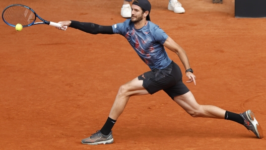 epa10598199 Italian Andrea Vavassori  in action during his men's singles match against Daniil Medvedev of Russia at the Madrid Open tennis tournament in Madrid, Spain, 29 April 2023.  EPA/Chema Moya