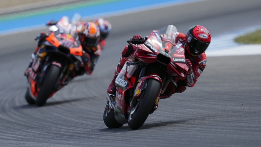 Francesco Bagnaia of Italy leads Brad Binder of South Africa and Australia's Jack Miller during the MotoGP race at the Circuito de Jerez in Jerez de la Frontera, Spain, Sunday, April 30, 2023. (AP Photo/Jose Breton)