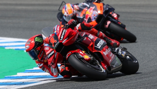 Ducati Italian rider Francesco Bagnaia (L) rides ahead of KTM Australian rider Jack Miller during the MotoGP Spanish Grand Prix at the Jerez racetrack in Jerez de la Frontera on April 30, 2023. (Photo by PIERRE-PHILIPPE MARCOU / AFP)