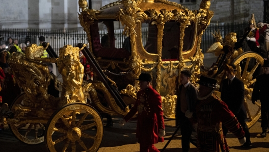 The Gold State Coach is led in a procession as it leaves Westminster Abbey in central London, early Wednesday, May 3, 2023, during a rehearsal for the coronation of King Charles III which will take place at Westminster Abbey on May 6. (AP Photo/Vadim Ghirda)