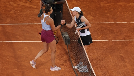 MADRID, SPAIN - MAY 06: Aryna Sabalenka is congratulated by Iga Swiatek of Poland after the women's final match on Day Thirteen of the Mutua Madrid Open at La Caja Magica on May 06, 2023 in Madrid, Spain. (Photo by Julian Finney/Getty Images)