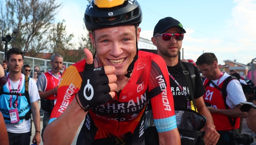 Bahrain - Victorious's Italian rider Jonathan Milan celebrates after winning the second stage of the Giro d'Italia 2023 cycling race, 202 km between Teramo and San Salvo, on May 7, 2023. (Photo by Luca Bettini / AFP)