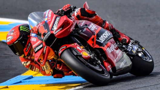 Ducati Lenovo Team's Italian rider Pecco  Bagnaia rides  during the 2nd free practice session ahead of the French MotoGP Grand Prix race of the French motorcycling Grand Prix, in Le Mans, northwestern France, on May 12, 2023. (Photo by JEAN-FRANCOIS MONIER / AFP)