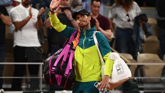 (FILES) Spain's Rafael Nadal waves to the crowd after Germany's Alexander Zverev conceded their men's semi-final singles match on day thirteen of the Roland-Garros Open tennis tournament at the Court Philippe-Chatrier in Paris on June 3, 2022. - Rafael Nadal on May 5 withdrew from the Rome Masters tournament as he continues his recovery from injury, casting serious doubts over his fitness for the French Open. (Photo by Christophe ARCHAMBAULT / AFP)