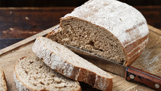 chopped rye bread on a dark brown wooden background