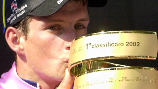 Italian cyclist Paolo Savoldelli kisses the trophy after winning the 20-stage Tour of Italy cycling race Sunday, June 2nd, 2002. The scandal-marred Giro was won by the unheralded  29-year-old cyclist of the Index Alexia team, taking a 1:41 minute overall lead over American runnerup Tyler Hamilton.   (AP Photo/Alessandro Trovati)