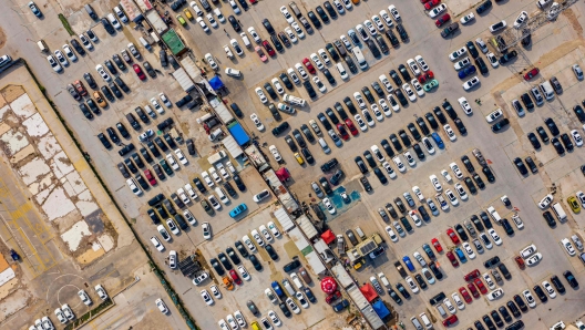 This aeiral photo taken on May 17, 2023 shows cars parked at a second-hand car market in Zhengzhou, in China's central Henan province. (Photo by AFP) / China OUT