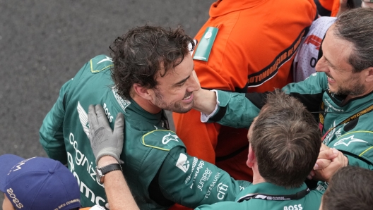 Aston Martin driver Fernando Alonso of Spain celebrates with his crew after placing second in the Monaco Formula One Grand Prix, at the Monaco racetrack, in Monaco, Sunday, May 28, 2023. (AP Photo/Luca Bruno)