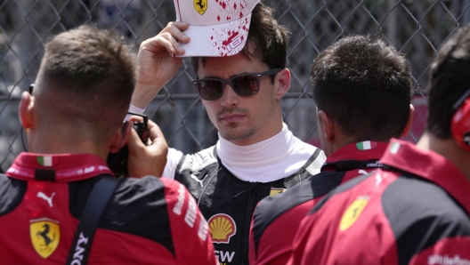 Ferrari driver Charles Leclerc of Monaco, center, prior to the Monaco Formula One Grand Prix, at the Monaco racetrack, in Monaco, Sunday, May 28, 2023. (AP Photo/Luca Bruno)