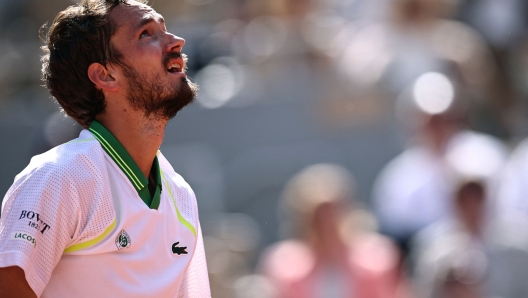 Russia's Daniil Medvedev reacts during his match against Brazil's Thiago Seyboth Wild during their men's singles match on day three of the Roland-Garros Open tennis tournament at the Court Philippe-Chatrier in Paris on May 30, 2023. (Photo by Anne-Christine POUJOULAT / AFP)