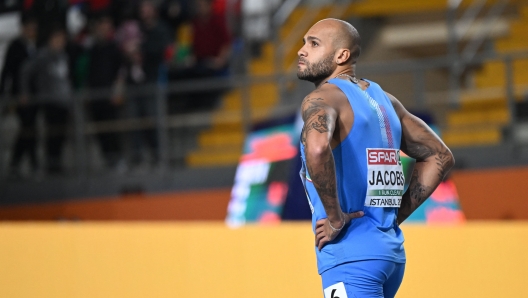 Italy's Lamont Marcell Jacobs looks on after the finals of the men's 60 metres during The European Indoor Athletics Championships at The Atakoy Athletics Arena in Istanbul on March 4, 2023. (Photo by OZAN KOSE / AFP)