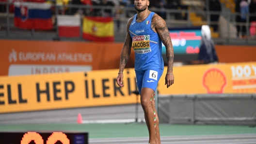 Italy's Lamont Marcell Jacobs looks on after the finals of the men's 60 metres during The European Indoor Athletics Championships at The Atakoy Athletics Arena in Istanbul on March 4, 2023. (Photo by OZAN KOSE / AFP)