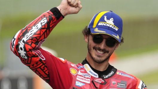 Italy's Francesco Bagnaia celebrates after winning the sprint race for the MotoGP Grand Prix of Italy at the Mugello circuit in Scarperia, Italy, Saturday, June 10, 2023. (AP Photo/Luca Bruno)