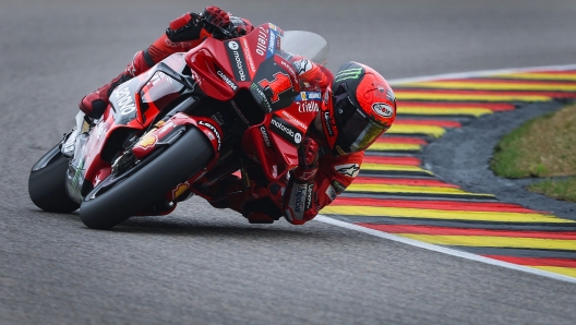 Ducati Lenovo Team's Italian rider Francesco Bagnaia steers his motorbike during the second free practice for the MotoGP German motorcycle Grand Prix at the Sachsenring racing circuit in Hohenstein-Ernstthal near Chemnitz, eastern Germany, on June 16, 2023. (Photo by Ronny Hartmann / AFP)