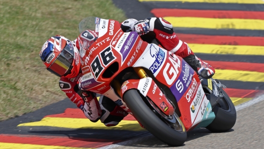 Britain's Jake Dixon, of the Polar Cube GASGAS Aspar team, steers his bike during the Moto2 race of the German Grand Prix, at the Sachsenring racing circuit, in Hohenstein-Ernstthal, Germany, Sunday, June 18, 2023. (Jan Woitas/dpa via AP)