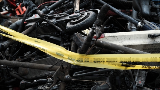 NEW YORK, NEW YORK - JUNE 20: Charred remains of e-bikes and scooters sit outside of a building in Chinatown after four people were killed by a fire in an e-bike repair shop overnight on June 20, 2023 in New York City. Lithium-ion e-bike batteries have caused numerous fires and fatalities in recent years due to the rising popularity of e-bikes for delivery purposes. New York City Mayor Eric Adams' administration has taken strong measures against unregulated e-bike and e-scooter batteries, which often present the highest risk when improperly charged.   Spencer Platt/Getty Images/AFP (Photo by SPENCER PLATT / GETTY IMAGES NORTH AMERICA / Getty Images via AFP)