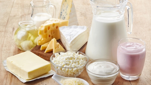 Various fresh dairy products on wooden background