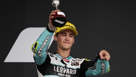 Third placed Jaume Masia of Spain celebrates on podium after completing the Moto 3 GP, at the Circuito de Jerez in Jerez de la Frontera, Spain, Sunday, April 30, 2023. (AP Photo/Jose Breton)