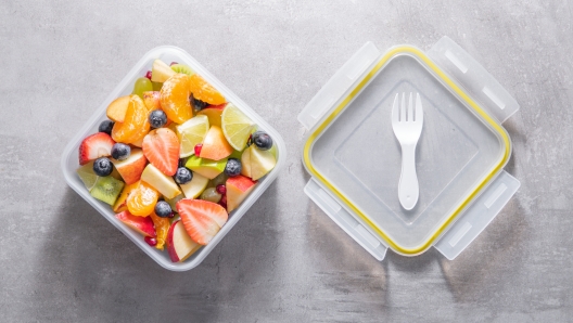 Packed fruit salad in plastic box. Healthy meal to go