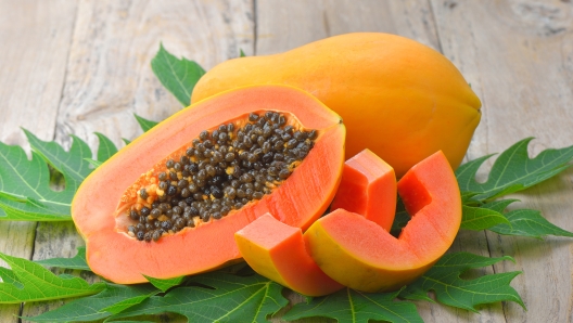 papaya on wooden background