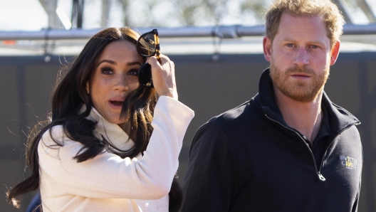 FILE - Prince Harry and Meghan Markle, Duke and Duchess of Sussex visit the track and field event at the Invictus Games in The Hague, Netherlands, Sunday, April 17, 2022.   The production company founded by Prince Harry and his wife, Meghan, are splitting ways with Spotify, Friday, June 16, 2023, less than a year after the debut of their podcast ?Archetypes."(AP Photo/Peter Dejong, File)