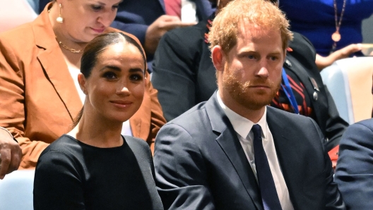 (FILES) Prince Harry (R) and Meghan Markle (L), the Duke and Duchess of Sussex, attend the 2020 UN Nelson Mandela Prize award ceremony at the United Nations in New York on July 18, 2022. A multi-million-dollar deal between a media group run by Britain's Prince Harry and his wife Meghan Markle, and streaming giant Spotify is to end, a report said June 15, 2023. (Photo by TIMOTHY A. CLARY / AFP)